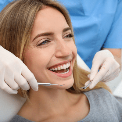 A woman smiling at dentist, representing cosmetic dentistry