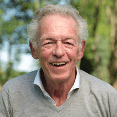 Older man posing for a photo, representing how to treat dry mouth as we age