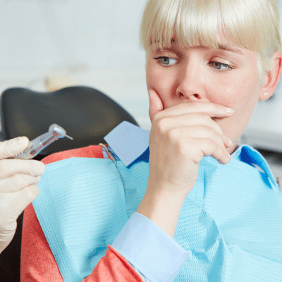 Nervous patient at dental appointment, representing how to overcome dental anxiety